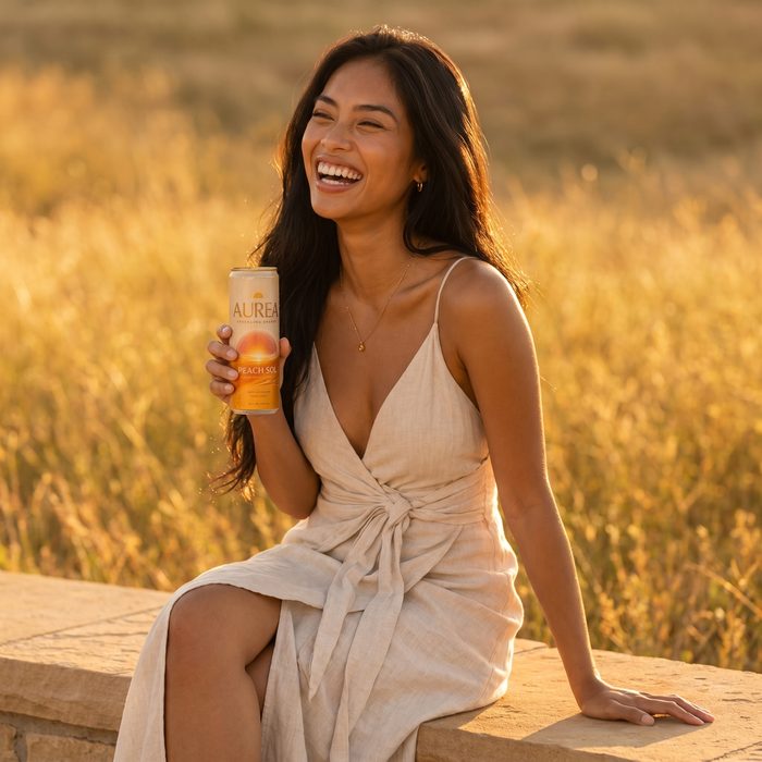AUREA model laughing with Peach Sol