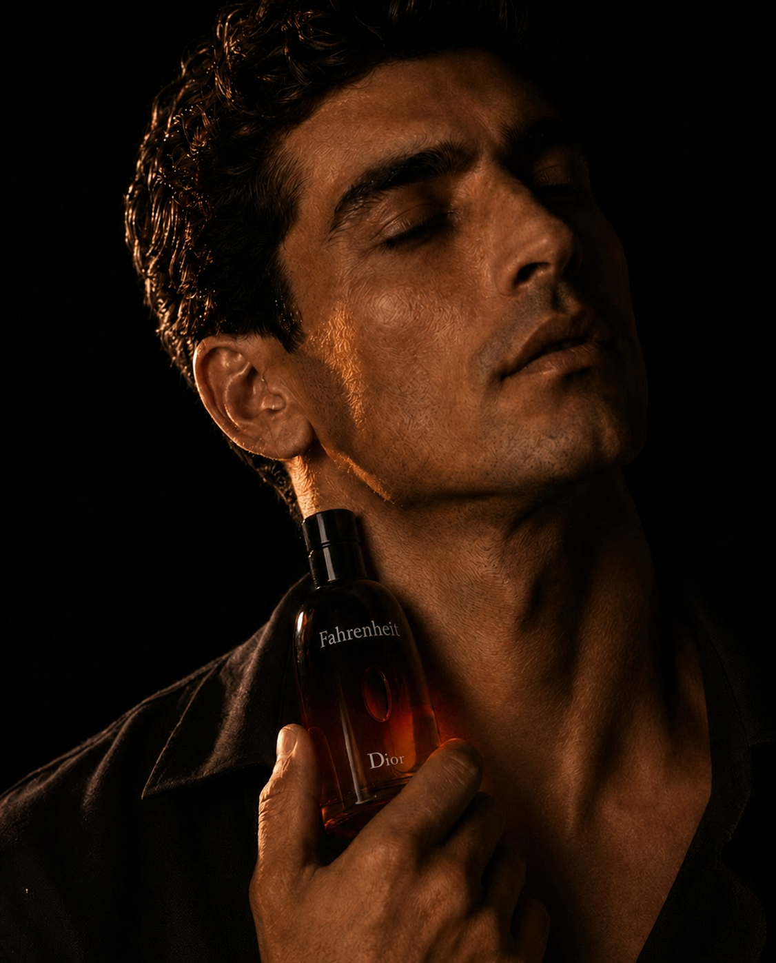 Close portrait of a man holding Dior Fahrenheit at his neck